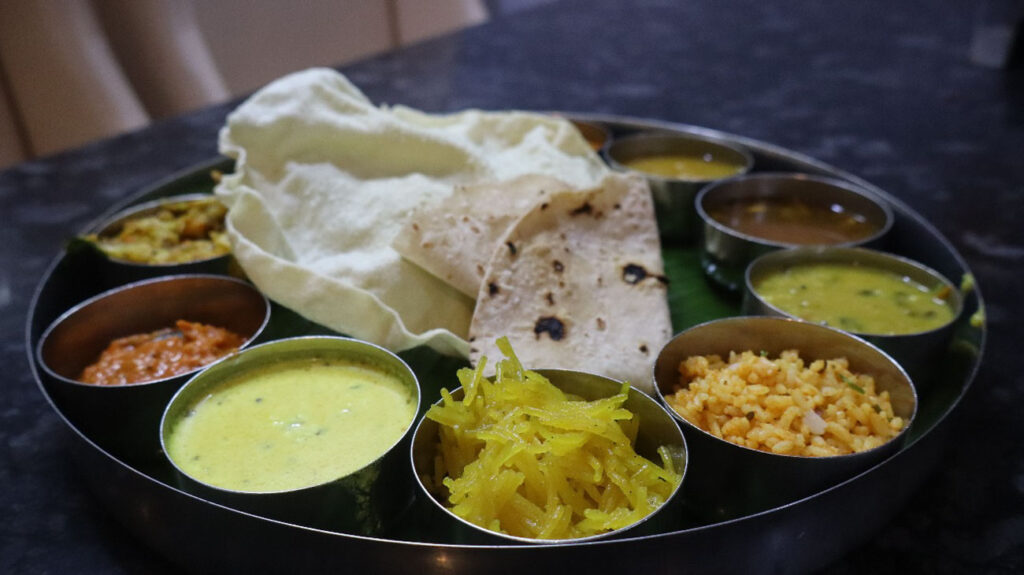 Plate With Food Sweet, Papad, Curd